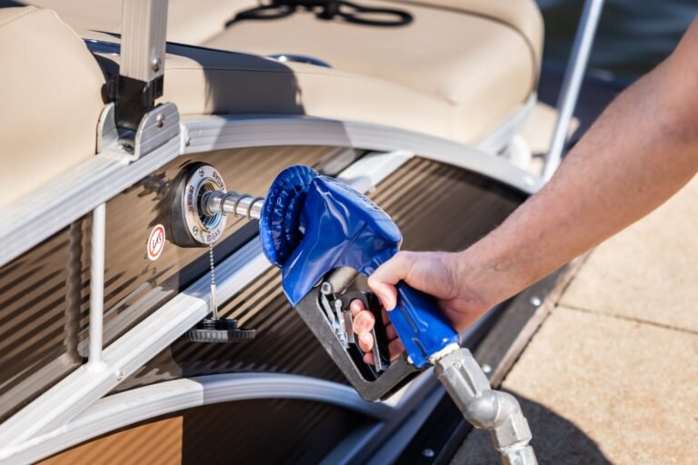 Man,Refueling,Boat,At,Marina